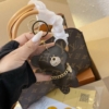 gau kem theo tui cong so lv louis vuitton brown