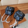 Balo Chanel 22A Duma Backpack Black Lambskin Màu Đen